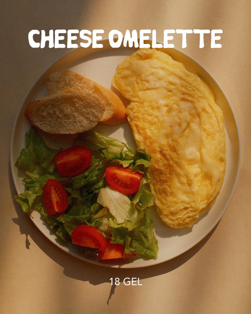 Cheese omelette with bread and salad