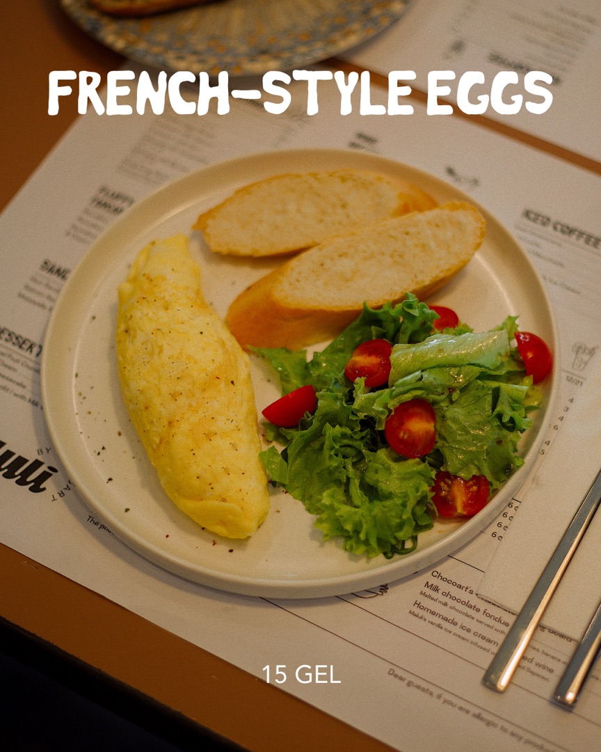 French-style eggs with bread and salad