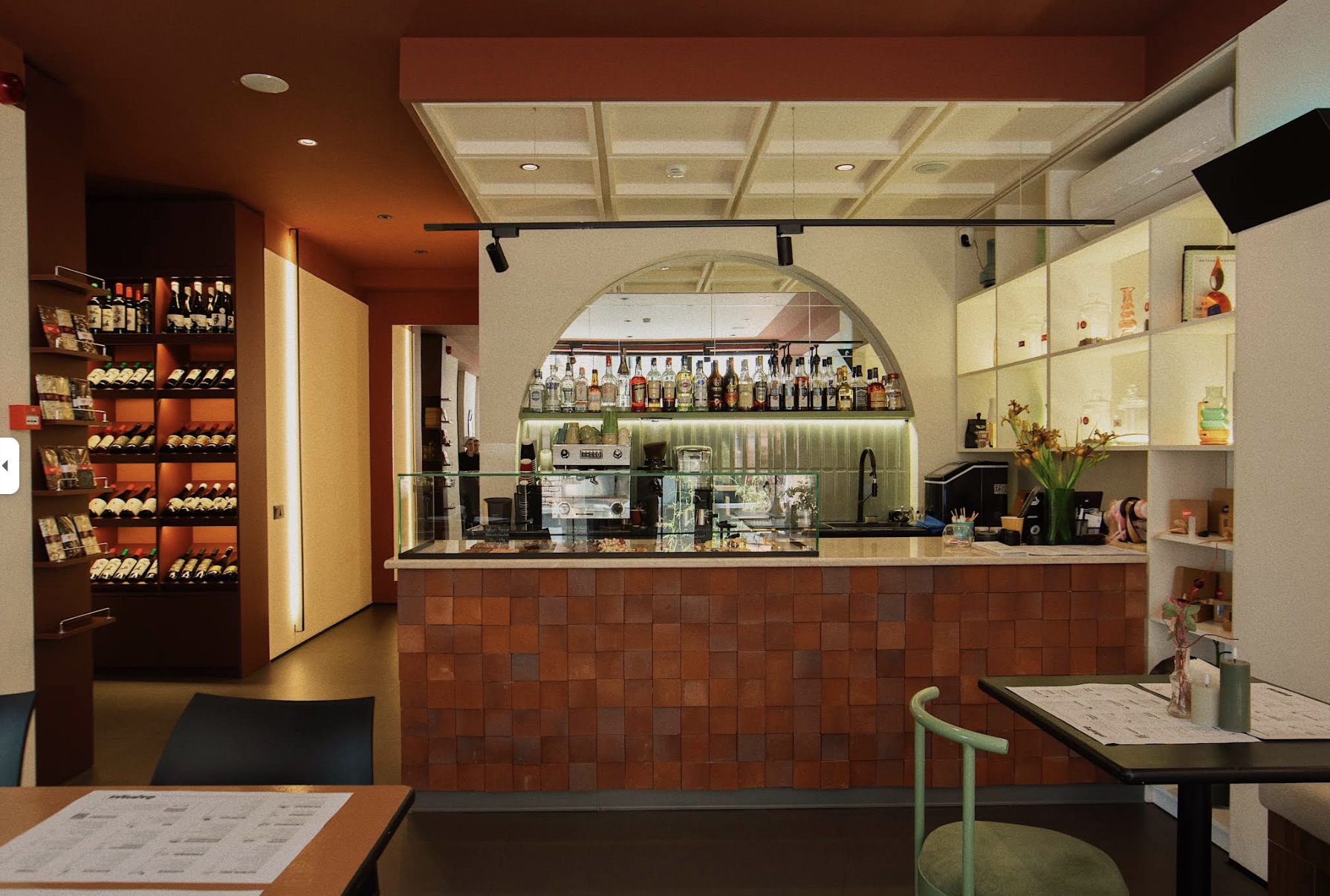 Maluli's tiled bar with wine display and pastry counter