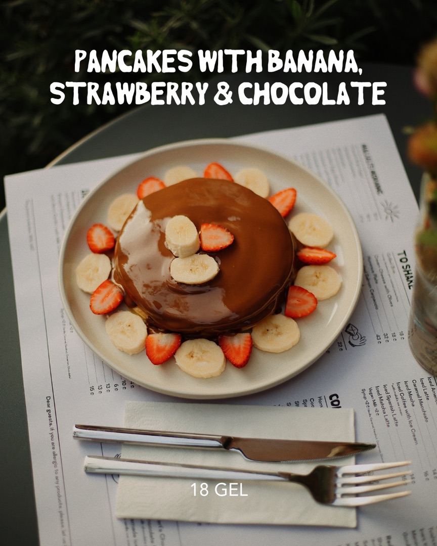 Pancakes with banana, strawberry and chocolate