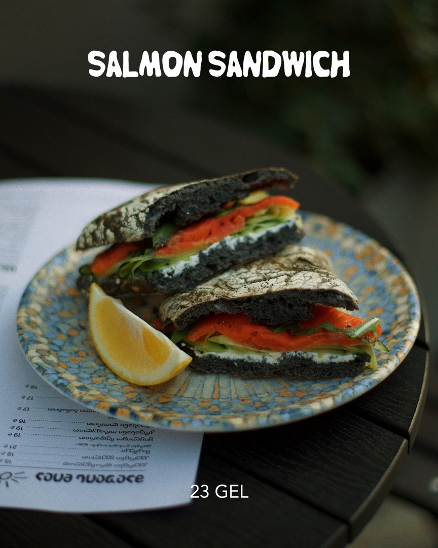 Salmon sandwich on charcoal bread